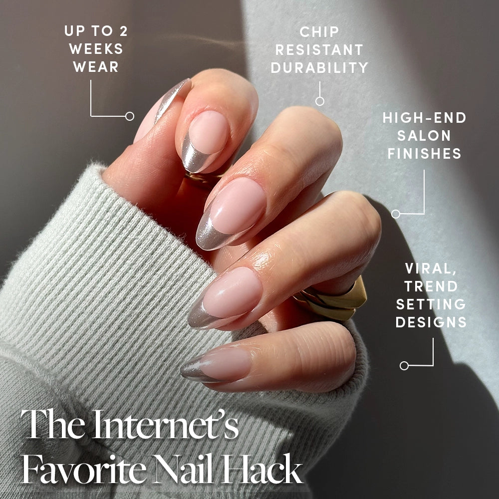 A hand flaunts glamnetic’s Mirror Mirror short almond press-ons with chrome silver tips. Text notes up to 2-week wear, chip-resistant durability, salon-quality vegan nails, cruelty-free formula, and viral trend-setting design. - Product image