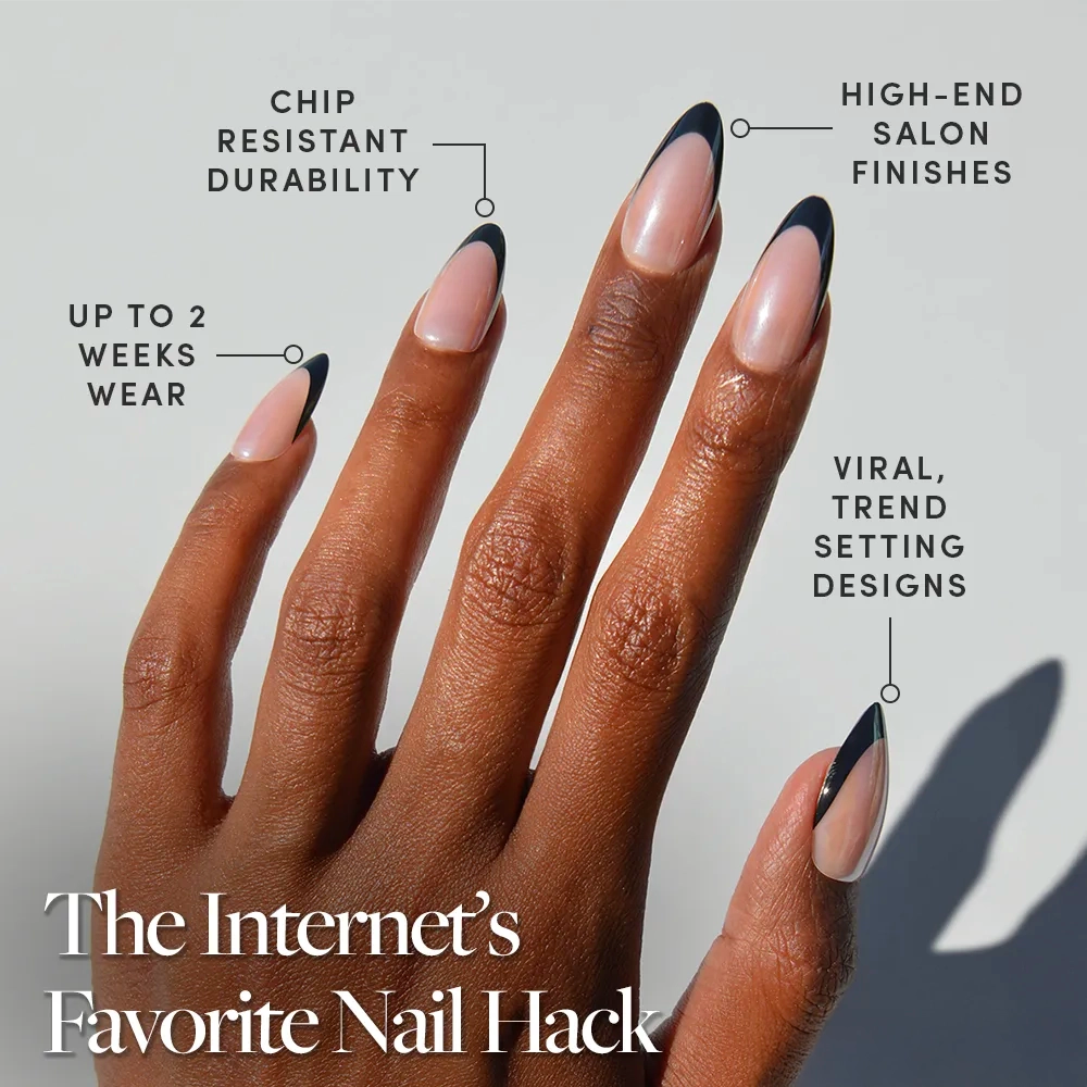 A hand with long, almond-shaped nails showcases glamnetic Black Truffle Press-On Nails in chic French tips. Enjoy chip-resistant durability, up to 2 weeks wear, salon-quality finish, and trend-setting viral style. - Product image