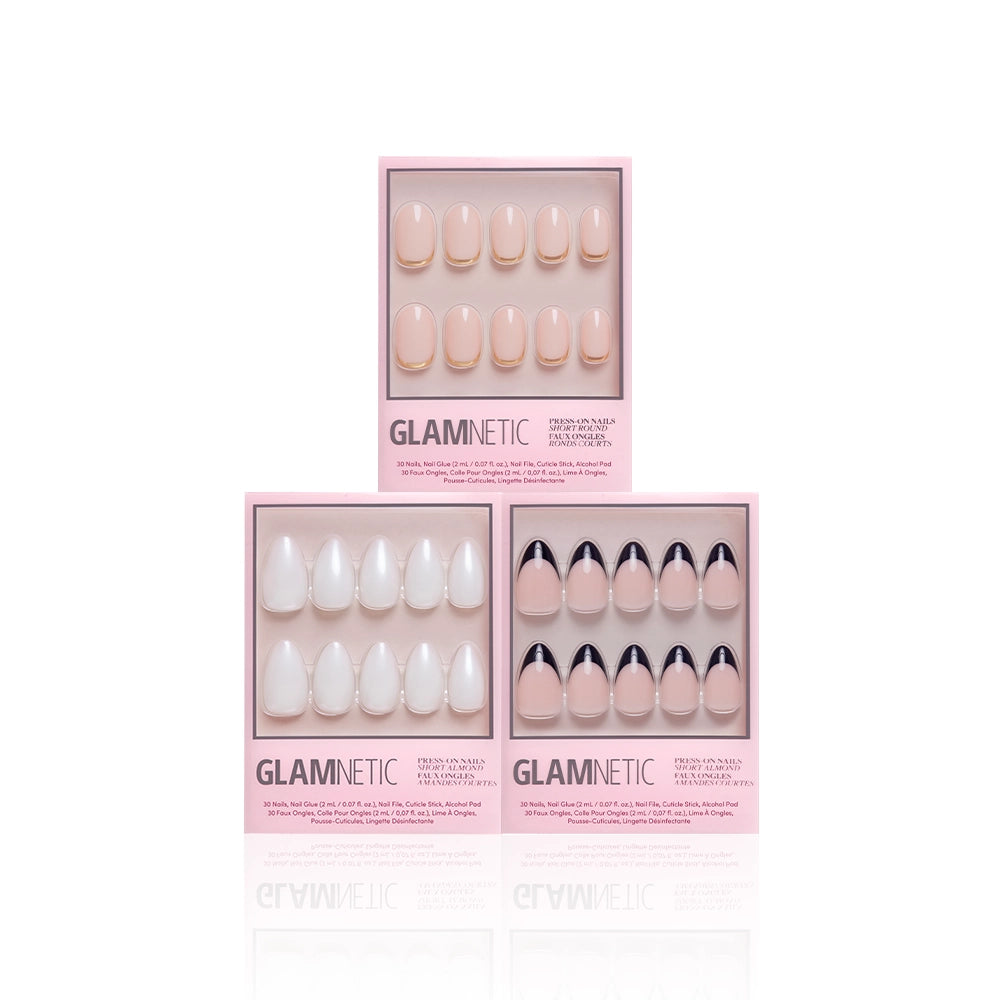 Three pink boxes of glamnetic press-on nails, called Elevated Everydays, are displayed: the top box has short almond beige nails, the bottom left shows white nails, and the bottom right offers beige nails with black French tips. Product details appear below each set. - Product image