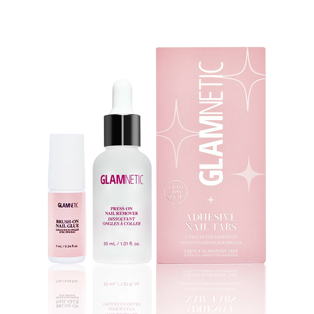 Three Glamnetic Press-On Perfection products ideal for flawless press-on nails: a small pink bottle of brush-on nail glue, a white dropper bottle of gentle nail remover for easy removal, and a pink box labeled Adhesive Nail Tabs by glamnetic. All items are neatly arranged side by side on a clean white background.