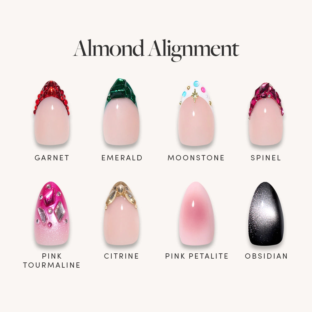 Glamnetic’s Almond Alignment features eight almond press-on nails inspired by gemstone designs—garnet, emerald, moonstone, spinel, pink tourmaline, citrine, pink petalite, and obsidian—for a dazzling look.
