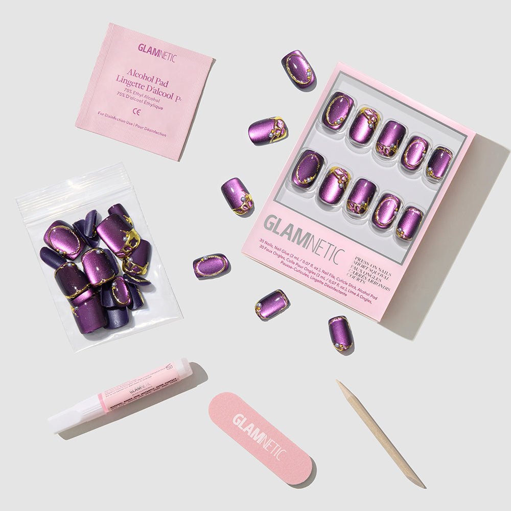 Glamnetic’s Amethyst Press-On Nails feature short squoval nails with a velvet finish plus glue, nail file, cuticle stick, alcohol pad, and extra nails—arranged on a light background in “glamnetic” packaging. - Product image