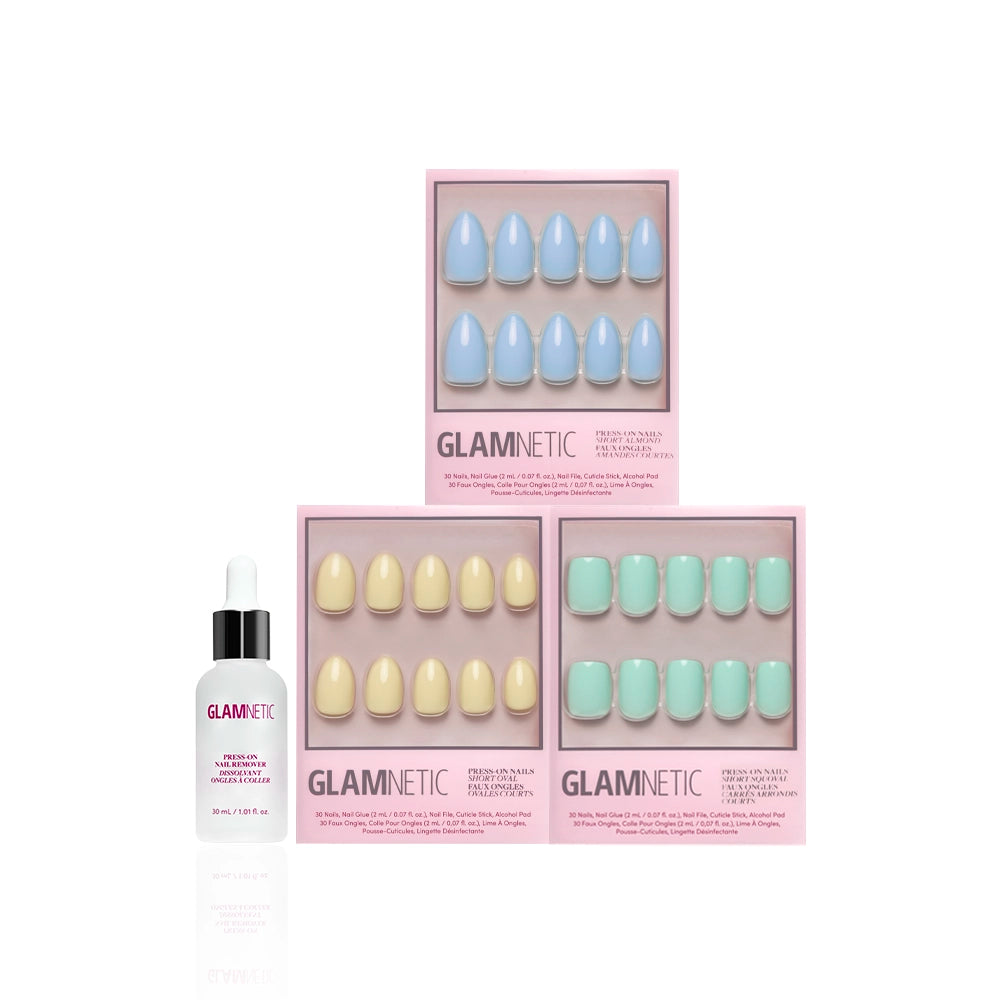 Three sets of glamnetic Ann's Palette short press-on nails in pastel blue, pastel yellow, and green are arranged in pink boxes, with a small bottle of glamnetic cuticle oil in front—perfect for fresh spring nails on a white background. - Product image