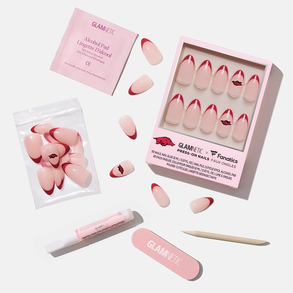 Show off your team spirit with the glamnetic Arkansas Razorbacks Press-On Nail Set. Includes pink and red French-tip nails, alcohol pad, nail glue pen, cuticle stick, nail file, extra nails, and a Glamnetic x Fanatics box—perfect for game day!. - Product image