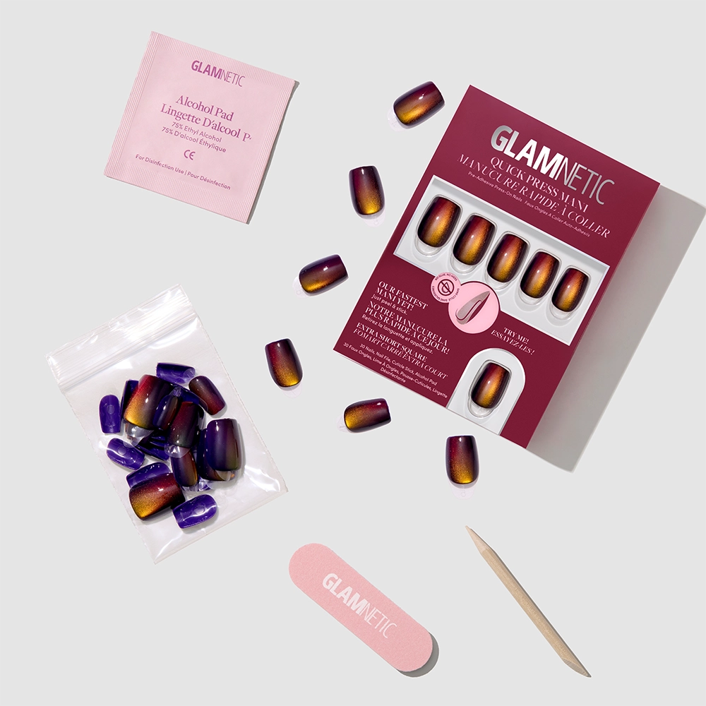 Glamnetic Aura Reading Quick Press Mani set, featuring gradient press-on nails, includes no-glue nails, an alcohol pad, nail file, cuticle stick, and extra nails all arranged neatly on a light background. - Product image