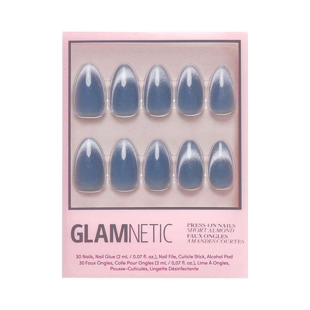 A box of glamnetic Baby Blues press-on nails in short almond shape, shown in three rows. The glossy pastel blue nails have a velvet metallic finish; package includes nail glue, file, cuticle stick, and alcohol pad. - Product image
