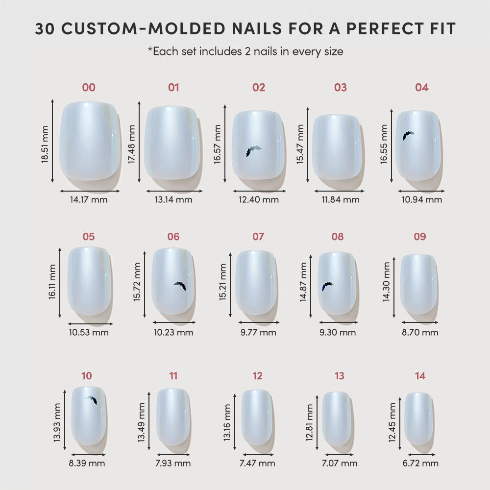 A chart displays 15 sizes of glamnetic Batty Bits white Press-On Nails, each labeled with width and length measurements in millimeters. Some Short Squoval Nails feature a small black logo. The top text reads: “30 custom-molded nails for a perfect fit.”. - Product image
