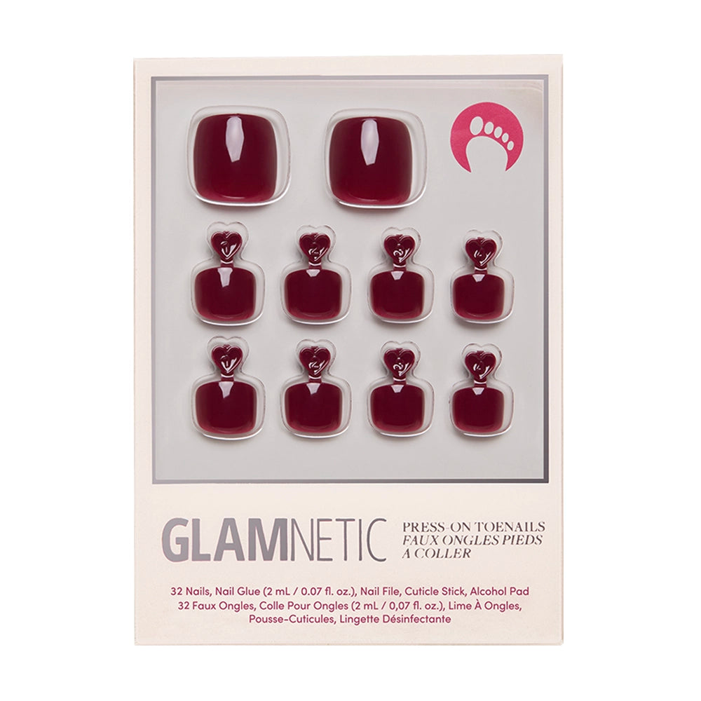 The glamnetic Berry Maroon Toenail set features 32 vegan, cruelty-free press-on toenails in a deep red shade, plus nail glue, a cuticle pusher, nail file, and cleansing pad for easy application.