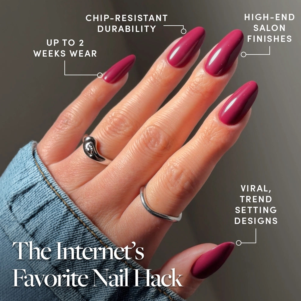 A hand with long, almond-shaped, dark pink glamnetic Berry Tempted press-on nails is shown, highlighting chip-resistant durability, salon-quality finish, up to 2 weeks wear, and viral trend-setting designs. - Product image