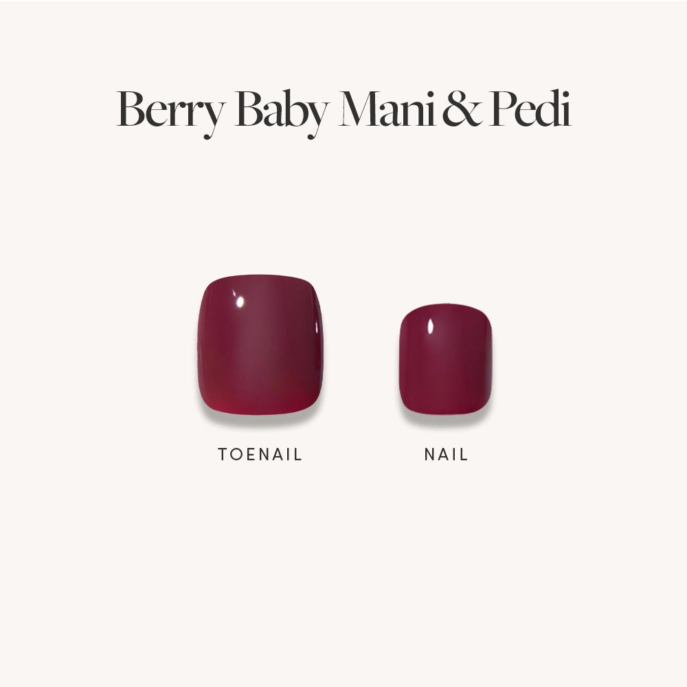Two glossy dark maroon press-on nails from glamnetic's Glossy Dark Maroon Mani & Pedi Bundles are displayed on a white background, one labeled "TOENAIL" and the other "NAIL." The text above reads Berry Baby Mani Pedi.