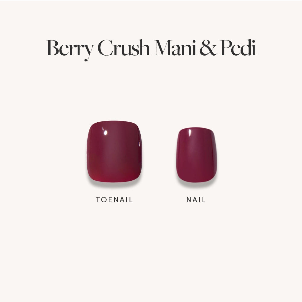 Two artificial nails—a large toenail and a small fingernail—painted in glossy dark maroon, are displayed on a plain background with the label "Glossy Dark Maroon Mani & Pedi Bundles" by glamnetic, an elegant high-gloss nail set. - Product image