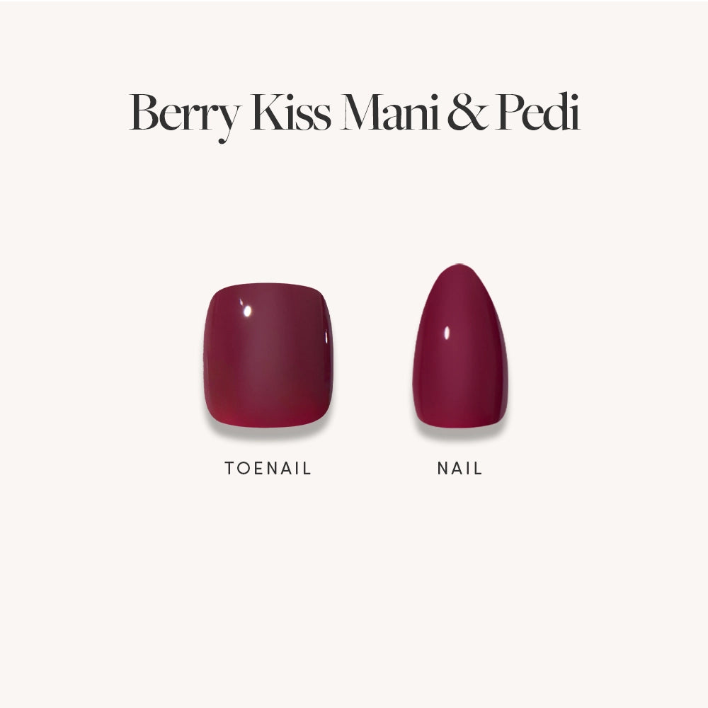 Two artificial nails on a light background, labeled "Toenail" and "Nail," both painted in a glossy dark maroon shade. The glamnetic Glossy Dark Maroon Mani & Pedi Bundles are featured with the text "Berry Kiss Mani Pedi. - Product image