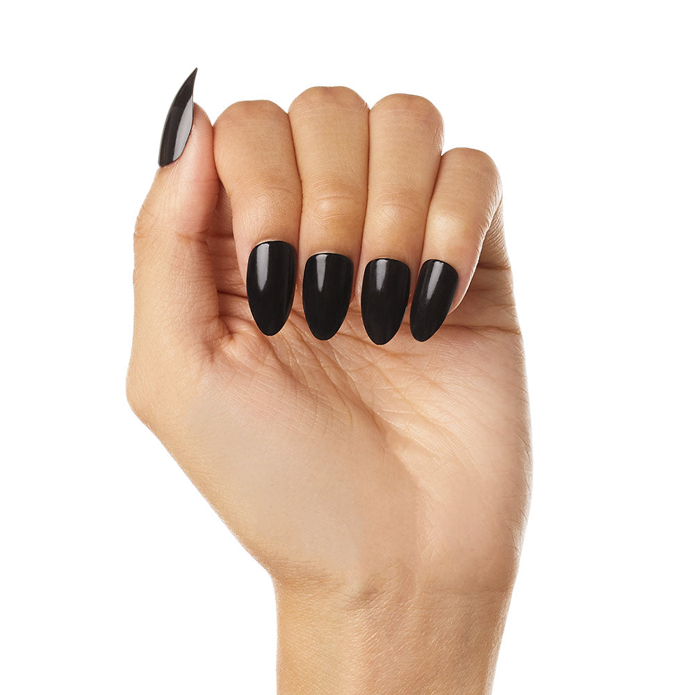 A hand with medium skin tone shows off long, almond-shaped nails painted in glossy black Boba by glamnetic—vegan and cruelty-free—against a white background. - Product image