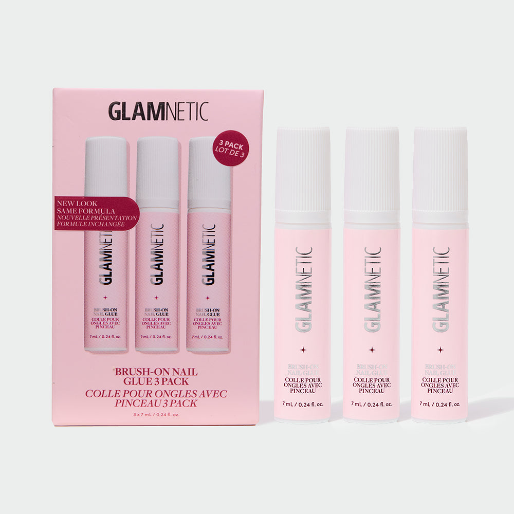 A glamnetic Glue Trio box in pink is displayed alongside three individual upright pink bottles of nail glue, all set against a white background—ideal for effortlessly applying your favorite press-on nails and achieving a salon-quality manicure at home.