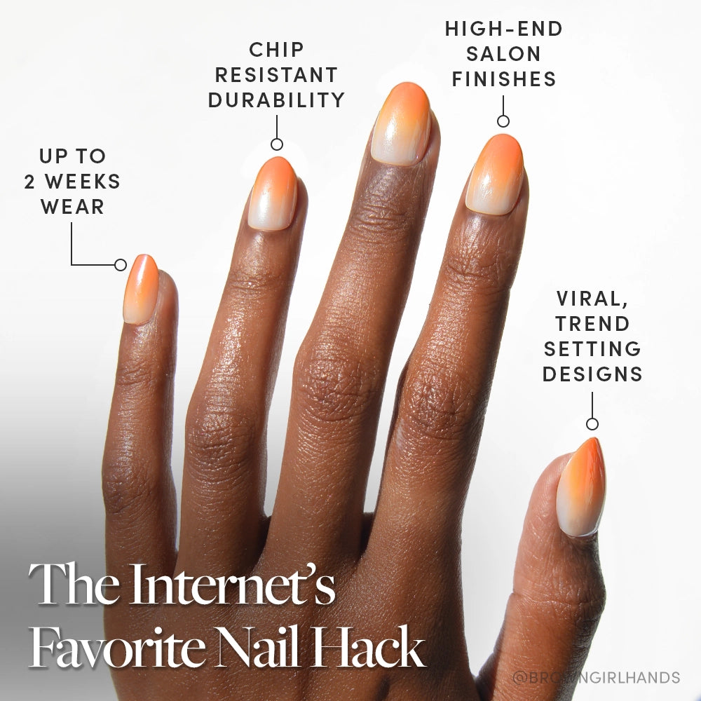 A hand with long almond-shaped nails in an orange and nude gradient design. Candy Corn by glamnetic offers up to 2 weeks wear, chip-resistant durability, and viral Halloween styles for a high-end salon finish. - Product image