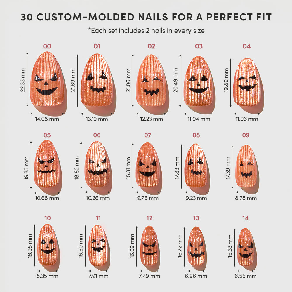 Fifteen pairs of glamnetic Carving Contest press-on nails, each featuring playful orange pumpkin-face nail art in various sizes, are arranged in rows on a light background with their measurements displayed nearby. - Product image