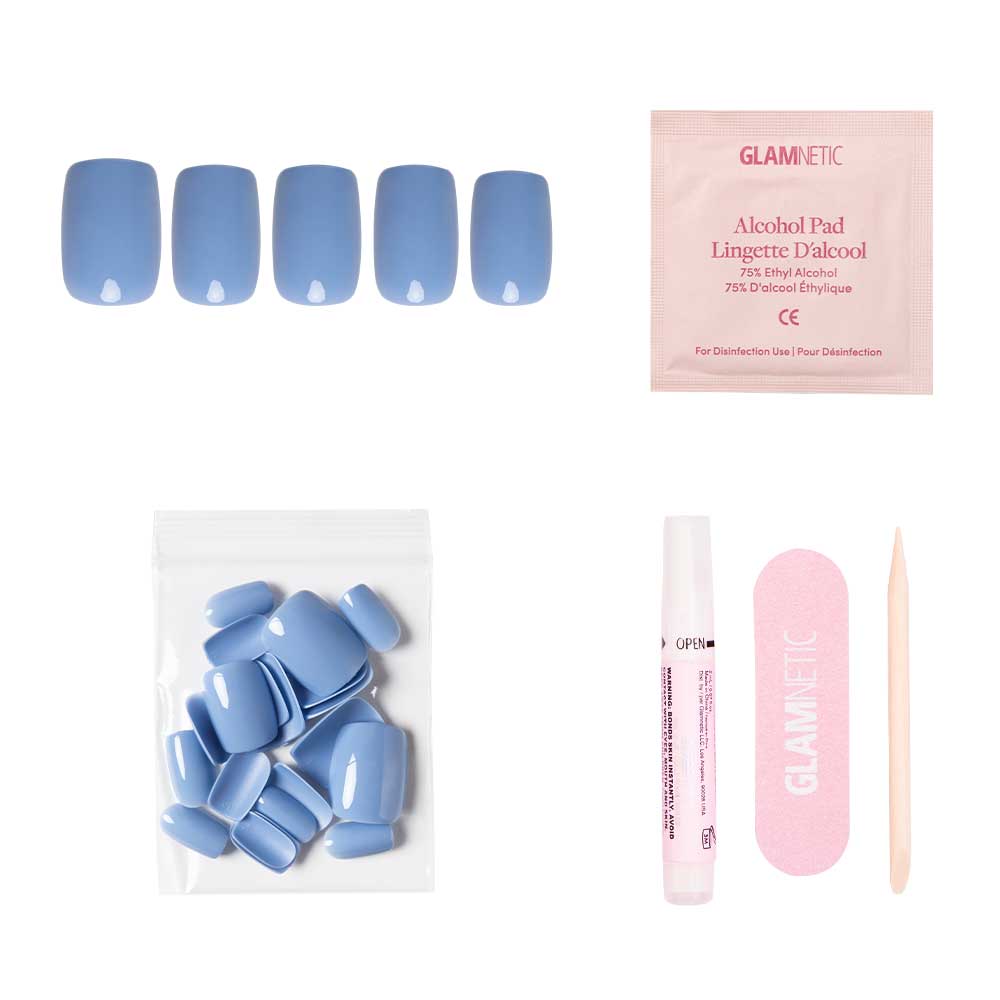 The glamnetic Cashmere Blue set includes vegan, cruelty-free short squoval nails, nail glue, extra nails, alcohol pad, pink file, and cuticle stick—all displayed on a white background. - Product image