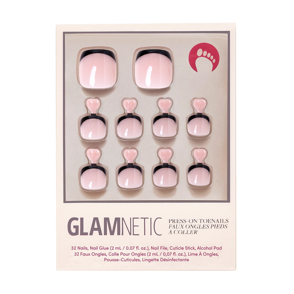 A box of Glamnetic press-on toenails in a nude pink shade with sleek black French tips.