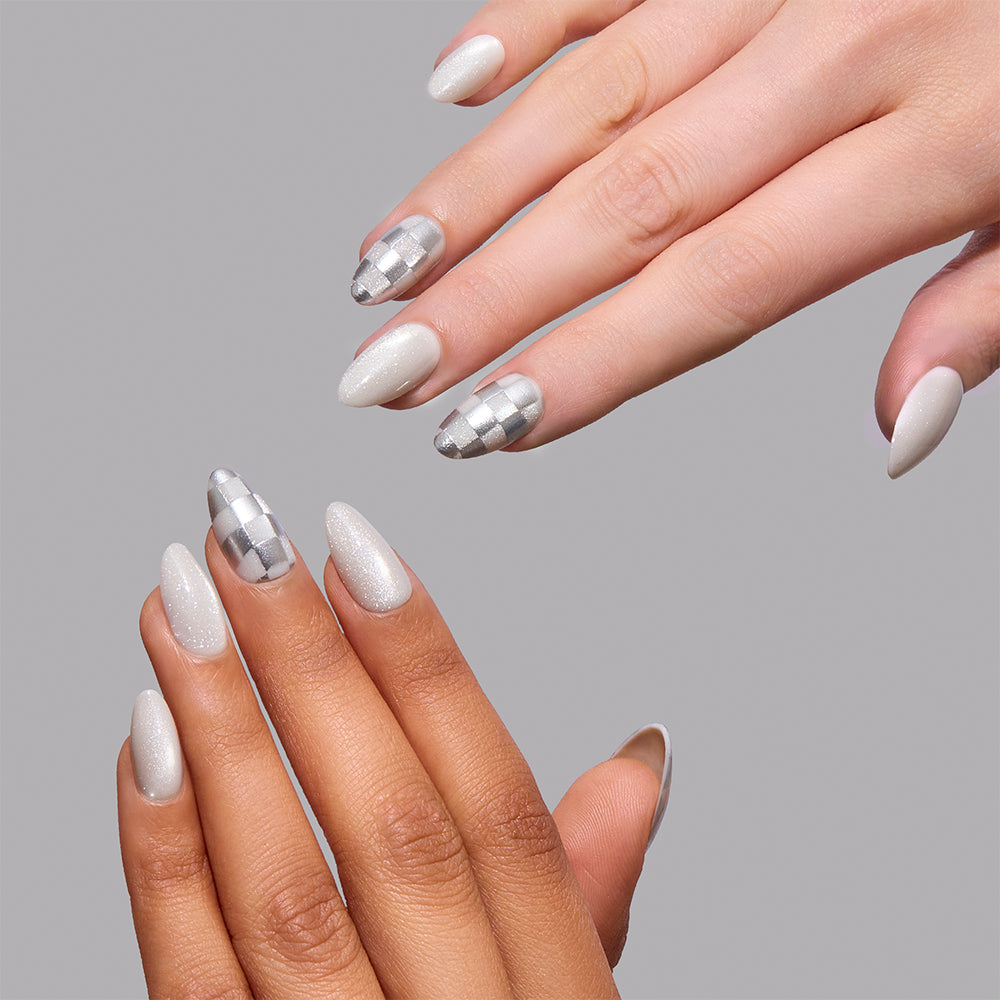 Short almond nails in Check-Mated by Glamnetic, featuring a mix of shimmering white polish and a silver checkered pattern with a velvet finish. - Product image