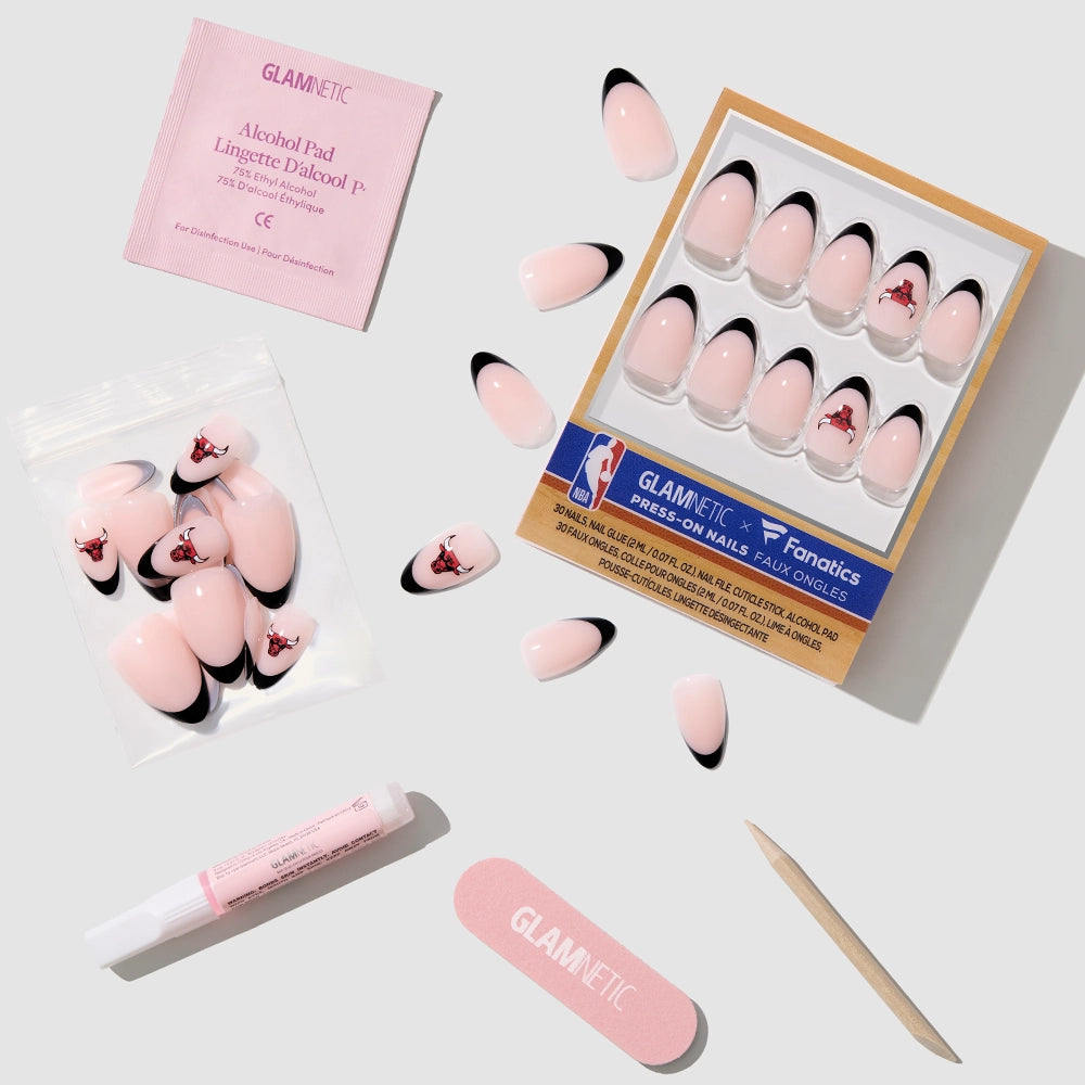 The glamnetic Chicago Bulls Press-On Nail Set features French tips and the team logo, and includes nail glue, alcohol pad, nail file, and cuticle stick for easy application. - Product image