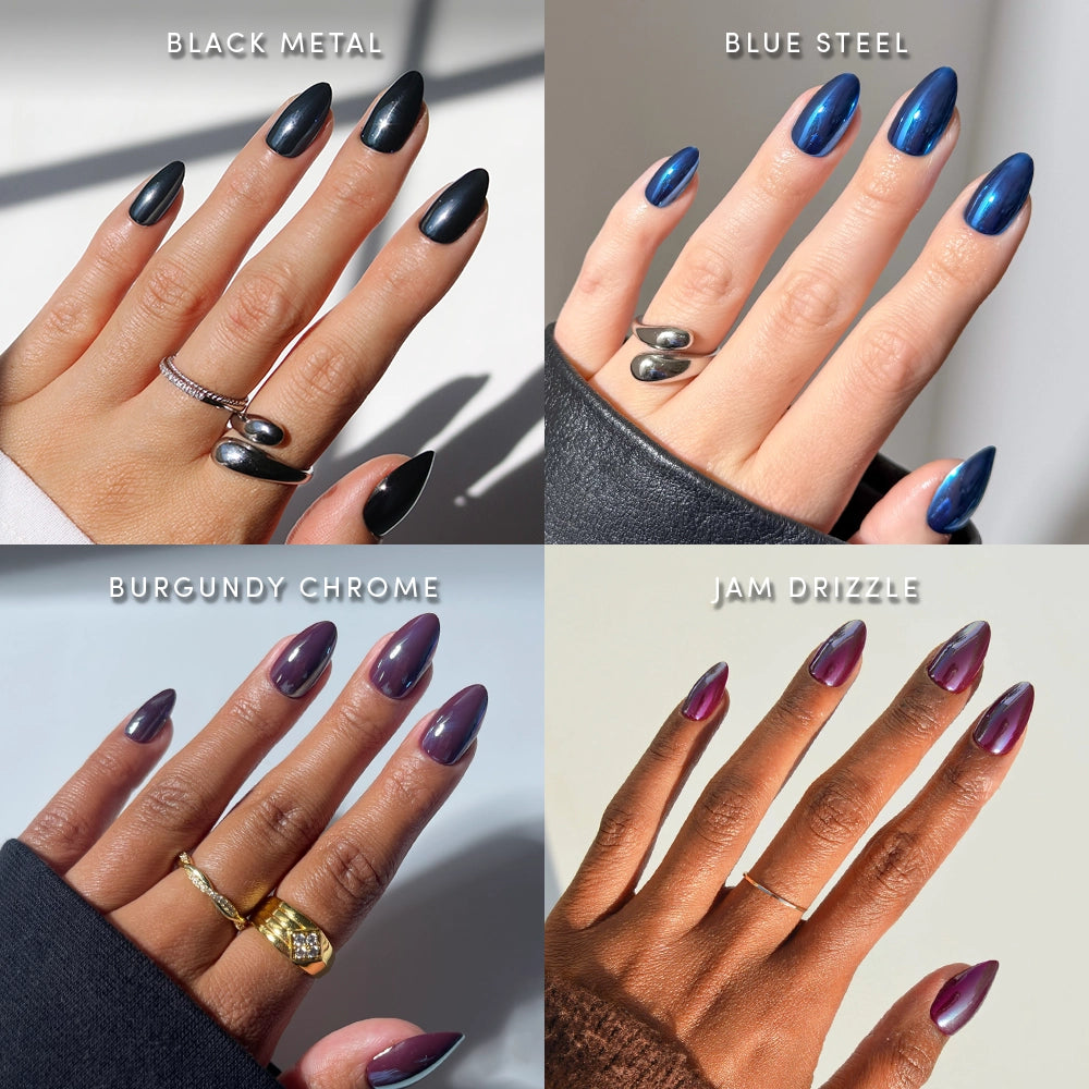 A collage of four hands showcases glamnetic's Heavy Metal Almonds press-on nails in metallic shades—black metal, blue steel, burgundy chrome, and jam drizzle—each labeled and accessorized with rings under bright lighting. The short almond shape spotlights trendy chrome finishes that can be effortlessly recreated for a bold, polished manicure.