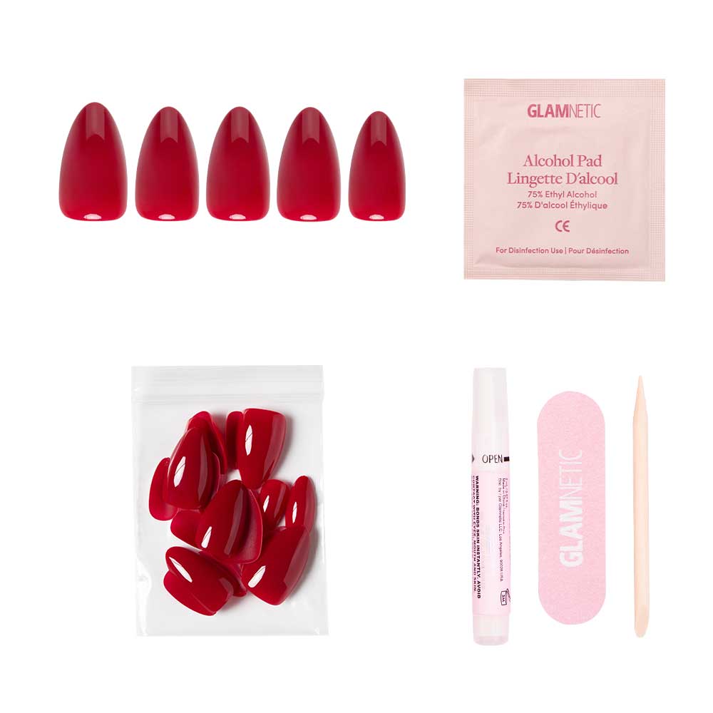 The glamnetic Classic Red nail set includes five glossy, almond-shaped nails, an alcohol pad, extra nails in a plastic bag, nail glue, a pink nail file, and a wooden cuticle stick—all displayed on a white background. - Product image