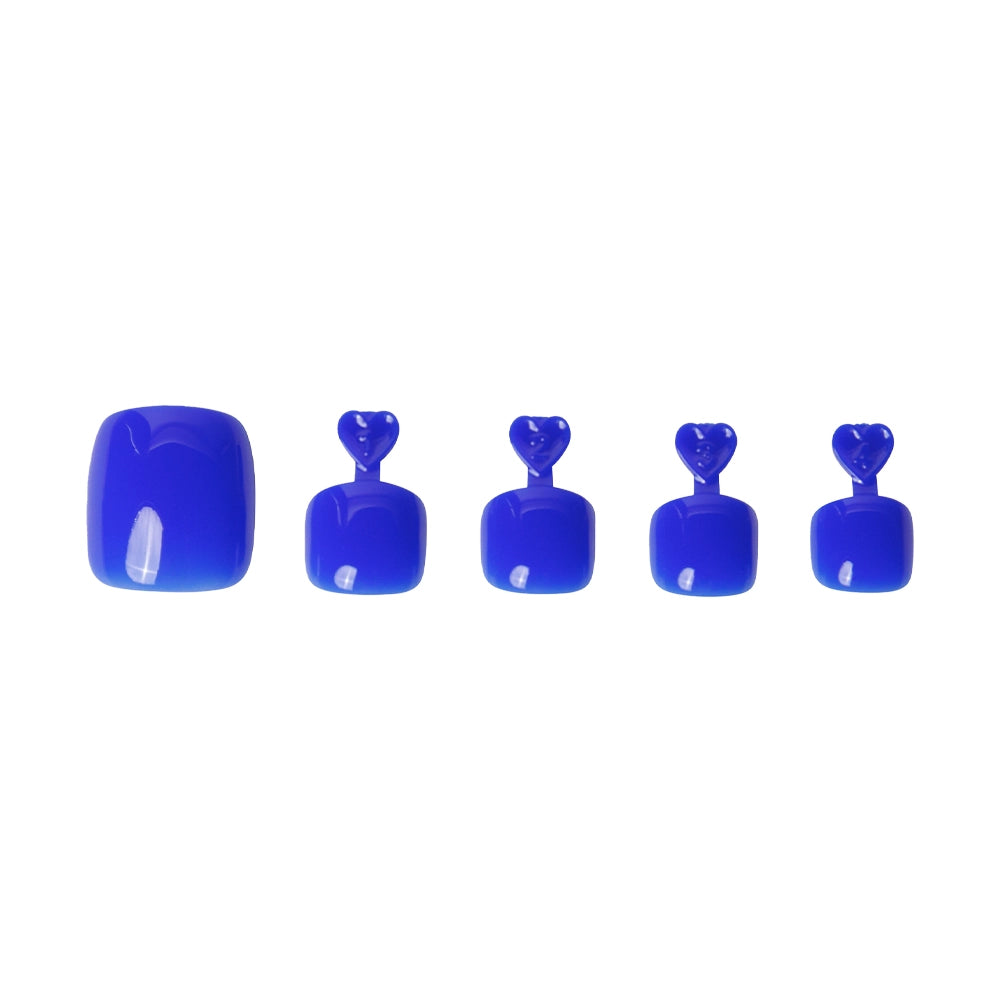 Glossy cobalt blue press-on toenails in five sizes, each with heart-shaped tabs for application. - Product image