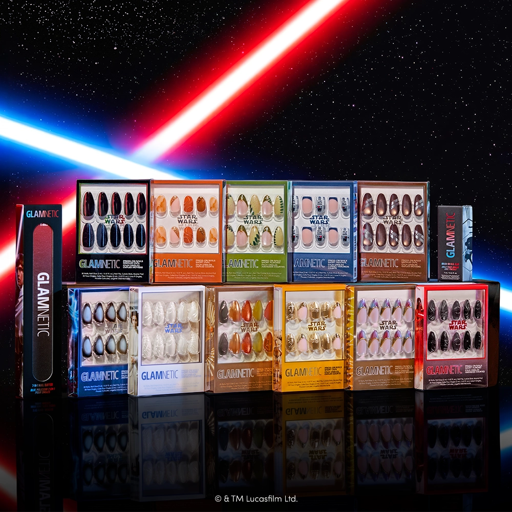 An artful arrangement of glamnetic’s Emperor almond press-on nails—a STAR WARS-inspired set—appears against a starry space backdrop, illuminated by red and blue lightsabers. These cruelty-free nails blend galactic style with out-of-this-world flair. - Product image