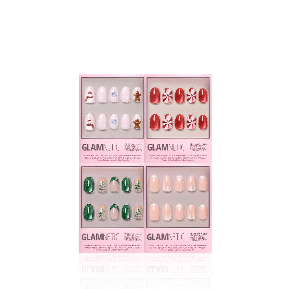 Four Glamnetic Cozied Up Ovals press-on nail sets in pink packaging—features festive holiday designs: snowman & gingerbread, red with peppermint, green with Christmas trees, and nude with subtle art—perfect for winter manis. - Product image