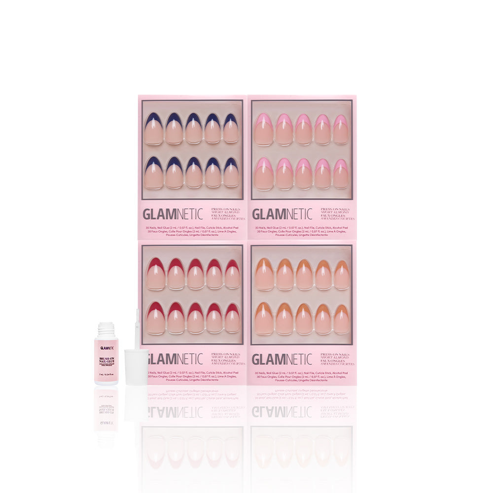 Four pink boxes of glamnetic Crème de la Chic press-on nails in French Tip and Short Almond styles are arranged in a grid, with a small white bottle of vegan, cruelty-free nail glue in front on a white background. - Product image