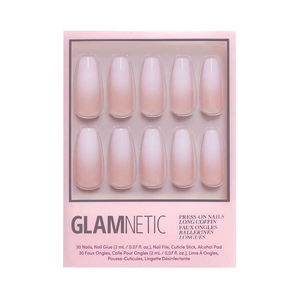A pink box of glamnetic Creme de Nude press-on nails in a long coffin shape, featuring 10 display nails with a nude ombre glossy finish. Packaging notes included nail glue, cuticle stick, and customizable nails. - Product image