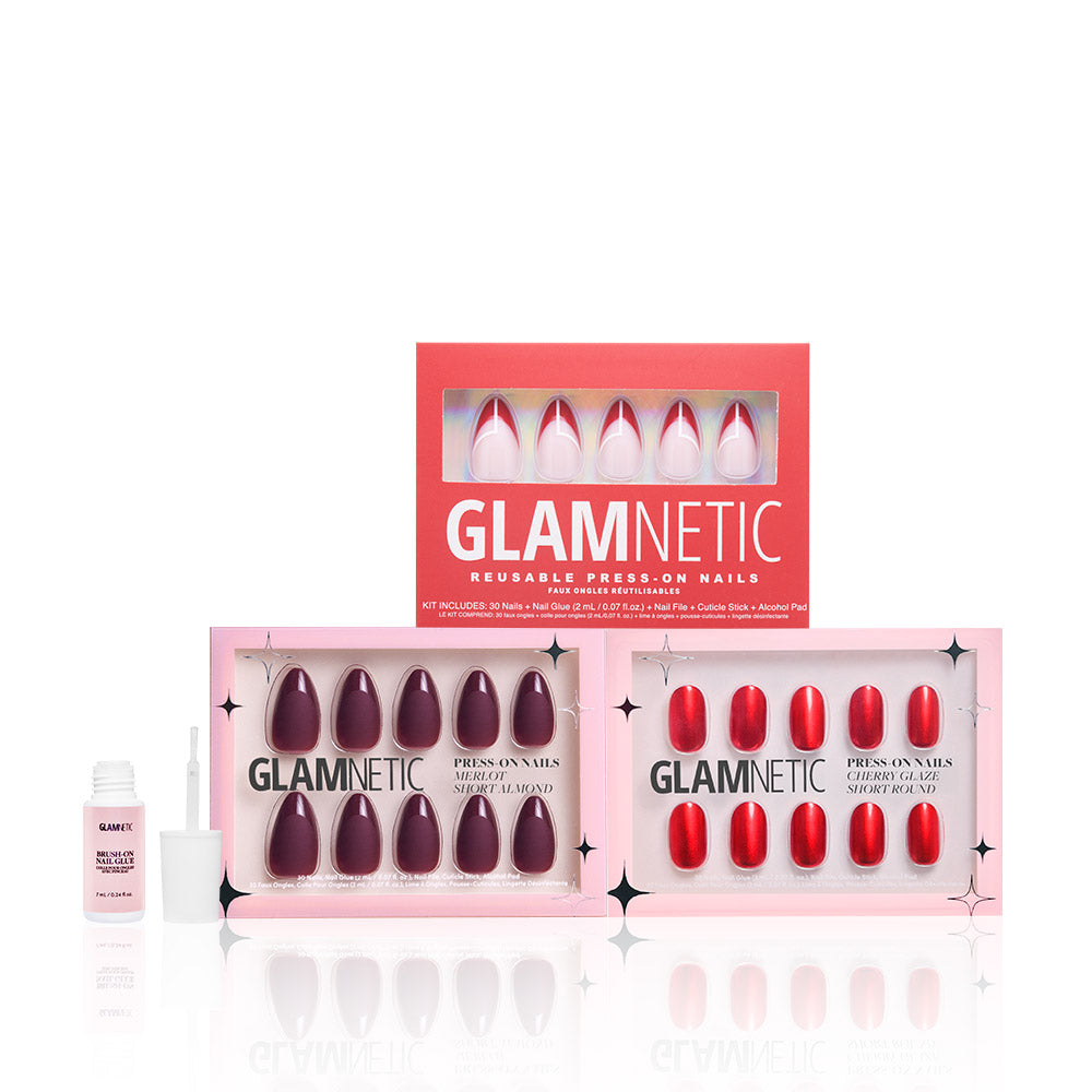 Three boxes of glamnetic Crimson Charm reusable press-on nails in Cherry Glaze, Red Martini Merlot, and other pink shades are displayed alongside nail glue. Pair with Press On Nail Remover for easy application and removal. - Product image