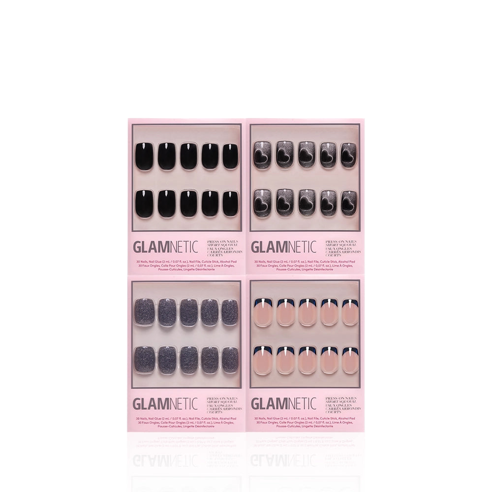 Four sets of glamnetic Dark Academia Squovals press-on nails in pink packaging—each showcasing a different style: glossy black, black with silver tips, glittery black, and nude with blue tips—are displayed on a white background. These squoval-shaped nails are perfect for anyone who loves bold black press-ons or chic short nail looks. - Product image