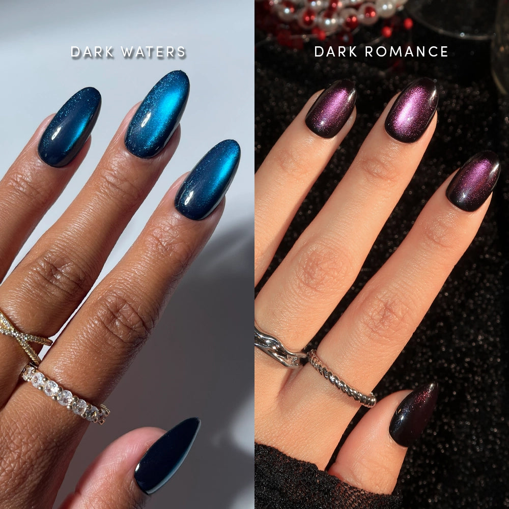 A side-by-side comparison of almond-shaped nails. Left: Dark Auras by glamnetic, featuring deep blue magnetic polish with a stunning velvet finish. Right: Dark Auras by glamnetic, featuring shimmering dark magenta magnetic polish. Both hands wear elegant rings.