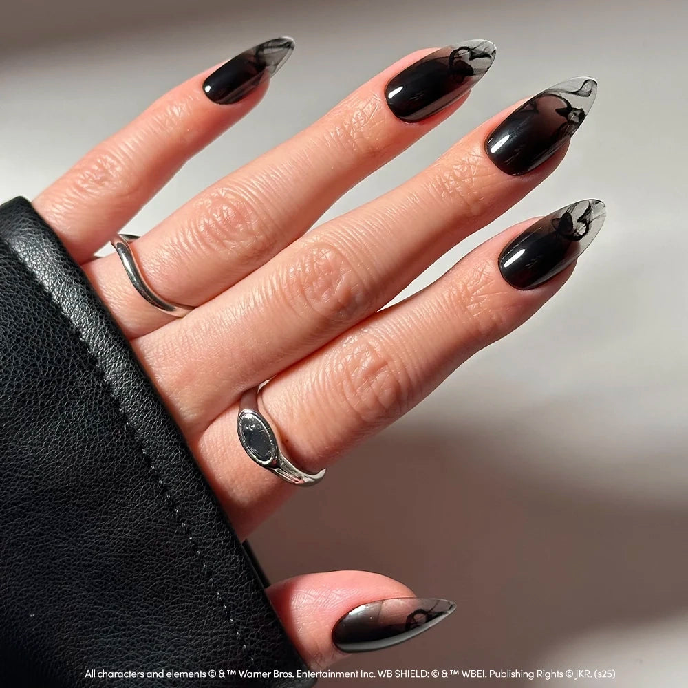 Almond-shaped Dementor™ press-on nails featuring a sheer black smoke effect and a faint, dark butterfly design near the tips. - Product image