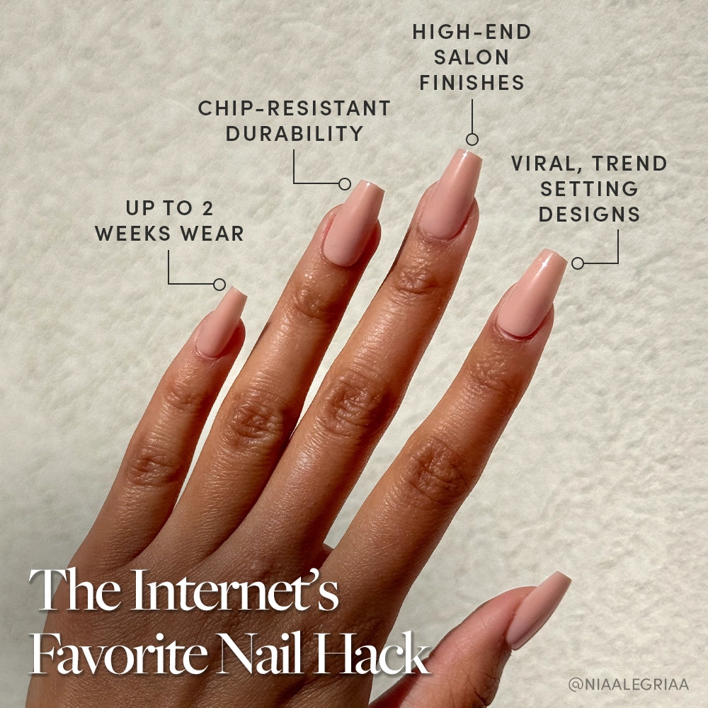 A hand with long, coffin-shaped pinky nude nails wears Exposed by glamnetic. Enjoy up to 2 weeks of chip-resistant, salon-quality wear with viral, trend-setting designs—the internet’s favorite nail hack!. - Product image