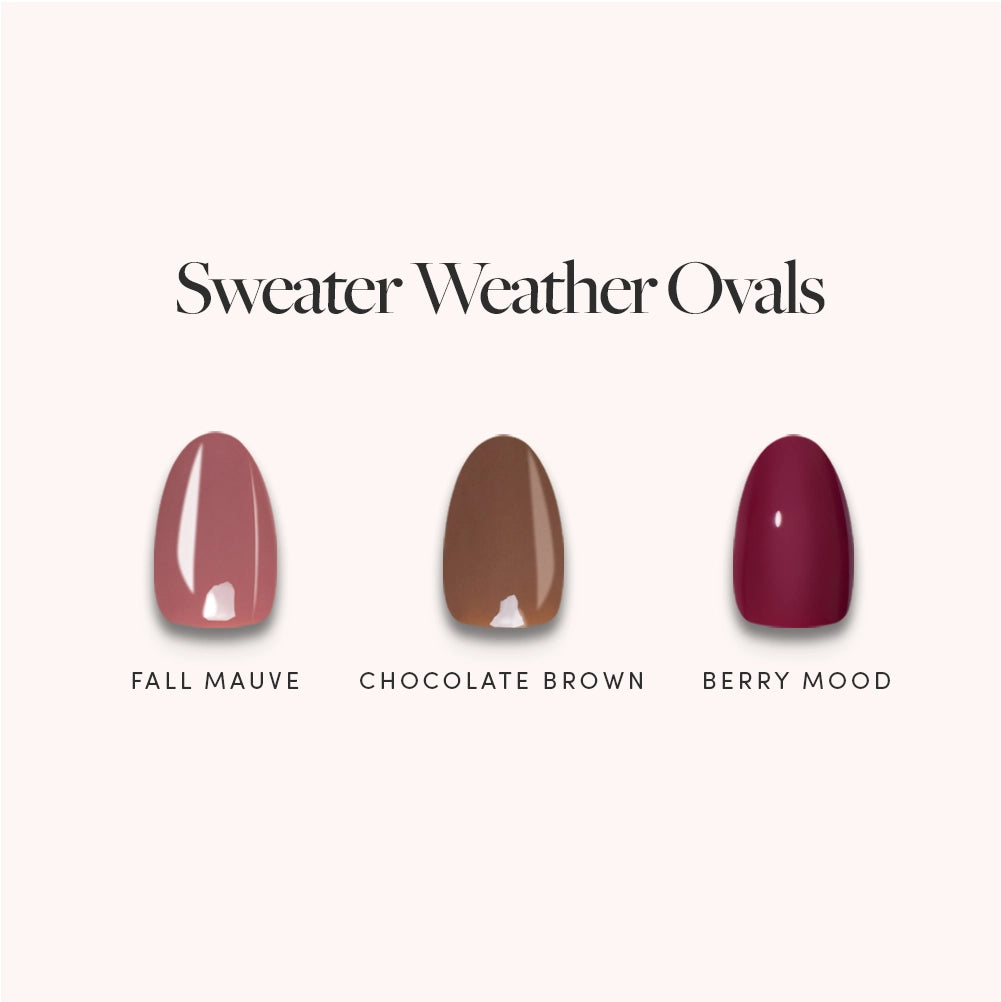 Three short oval press-on nail samples—Fall Mauve (pinkish), Chocolate Brown (brown), and Berry Mood (dark red)—from glamnetic’s Sweater Weather Ovals collection are displayed against a light background. These high-shine, glossy nails offer a polished finish designed for long-lasting, durable wear throughout the season.