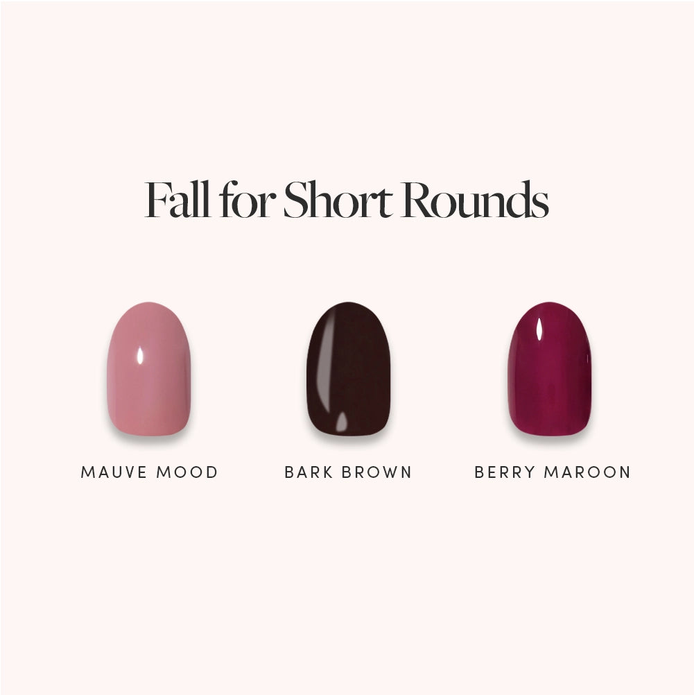 Under the heading “Fall for Short Rounds” by glamnetic, three short round press-on nail swatches in mauve, dark brown, and maroon—labeled “Mauve Mood,” “Bark Brown,” and “Berry Maroon”—offer salon-quality, easy-to-apply manicures for a chic and stylish look at your fingertips.
