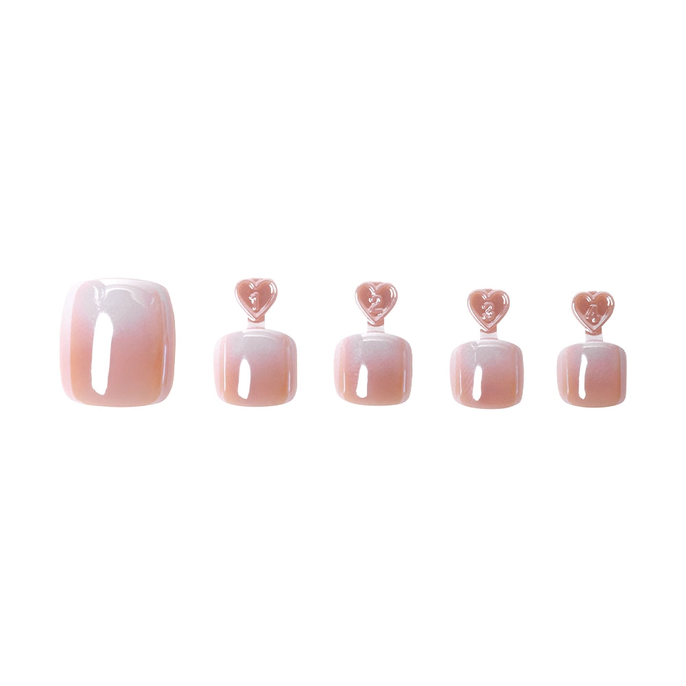 Iridescent light pink press-on toenails with a pearlescent sheen, arranged in a gradient of sizes with heart tabs for application - Product image