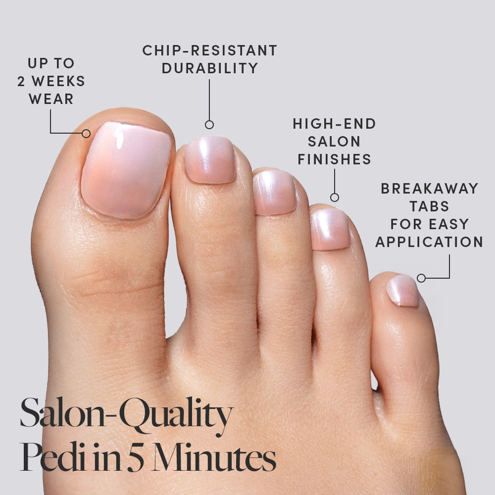 A foot showcasing pearly pink Glamnetic press-on toenails with callouts emphasizing 2-week wear, salon-quality finish, and easy application. - Product image