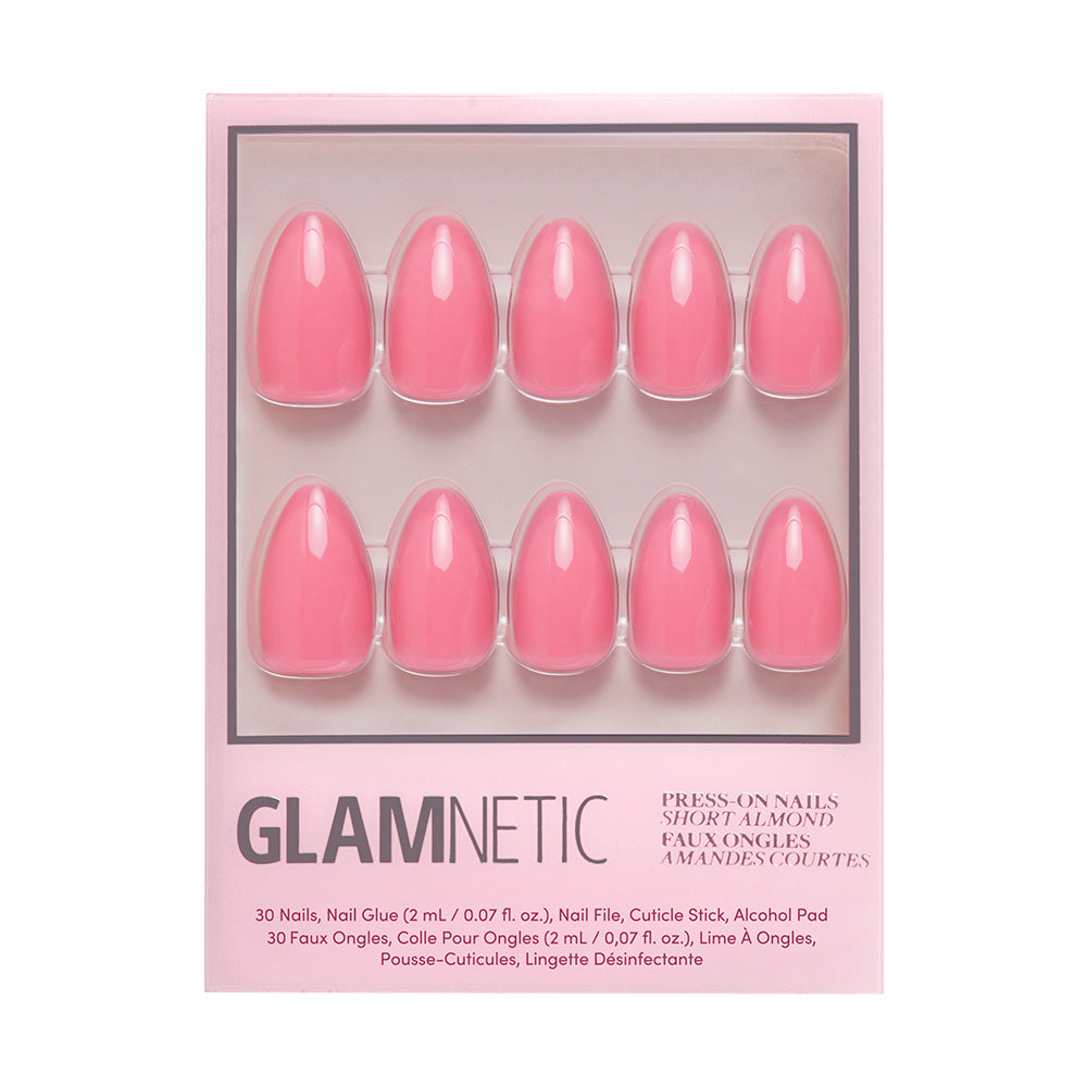 A box of glamnetic Flamingo Pink short almond nails in a glossy finish, arranged in two rows of five with product info and accessories beneath—ideal for summer fun or brightening up your daily style.