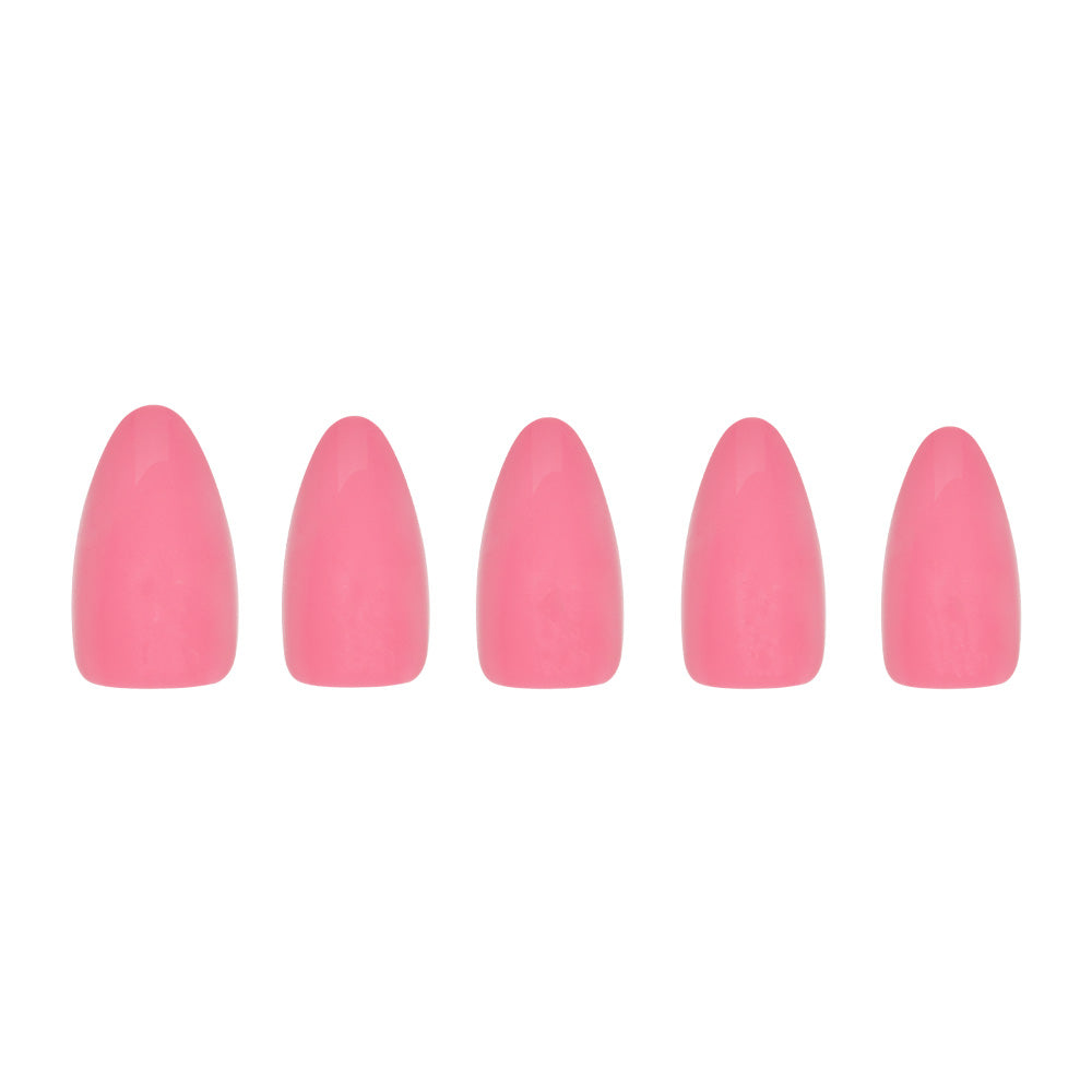 Five short almond nails from glamnetic in Flamingo Pink are arranged in a row on a white background—perfect for summer adventures. - Product image