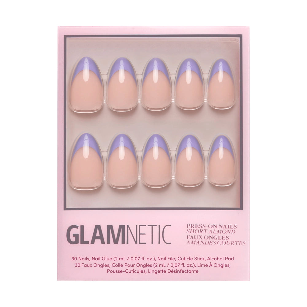 The glamnetic French Lilac set features 30 short almond press-on nails with a nude base and pastel purple tips, plus nail care accessories, all in a sleek pink package.