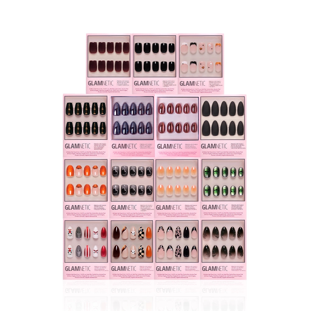 Sixteen boxes from glamnetic’s Fright Night Collection are displayed in a grid, each pink package featuring vibrant solid colors, patterns, and Halloween-inspired designs for a stylishly spooky touch. - Product image