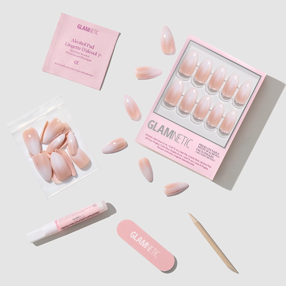 The glamnetic Frosted Chai set includes pale pink ombré almond press-on nails, a pink nail file, wooden cuticle stick, nail glue, alcohol pad, and extra nails—everything needed for a salon-quality mani at home. - Product image