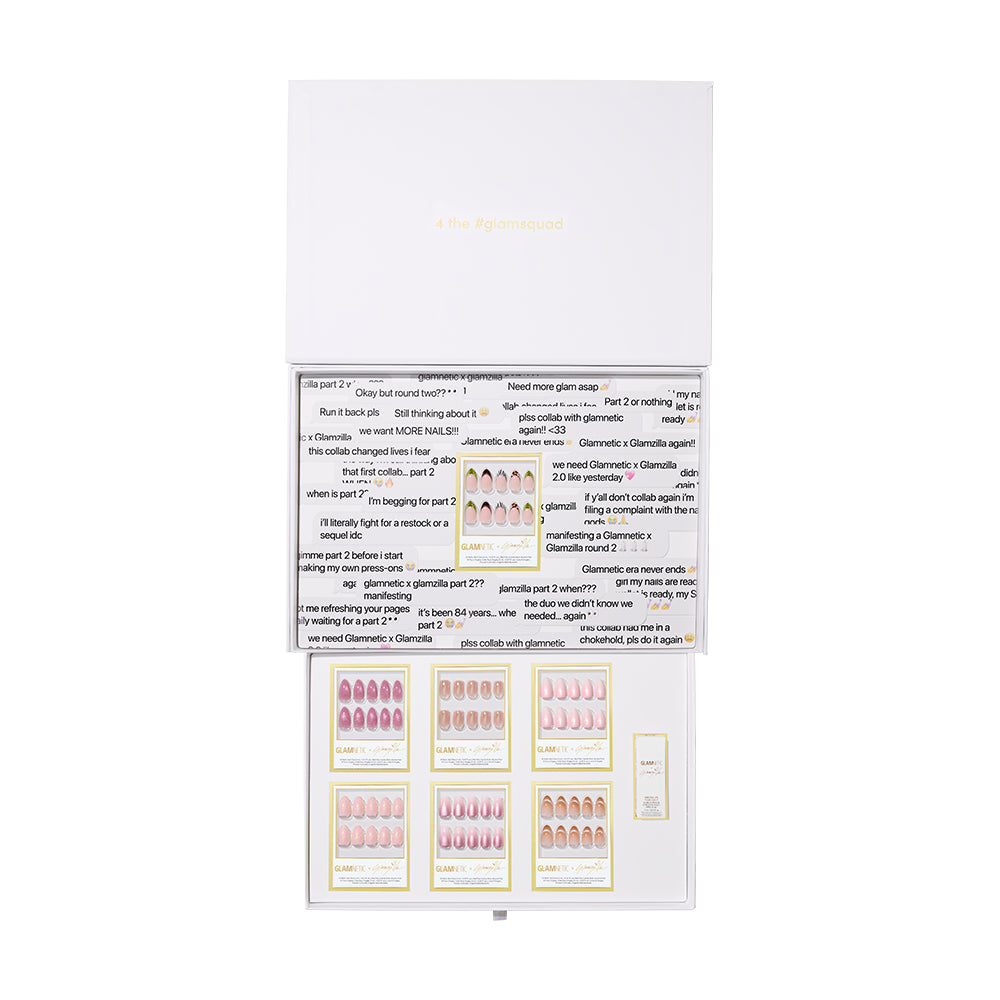 The GLAMNETIC X GLAMZILLA: GLAMSQUAD FOREVER PR BOX by glamnetic features multiple sets of artificial nails in assorted colors and designs, neatly organized in compartments inside an open white box with printed text on the lid.