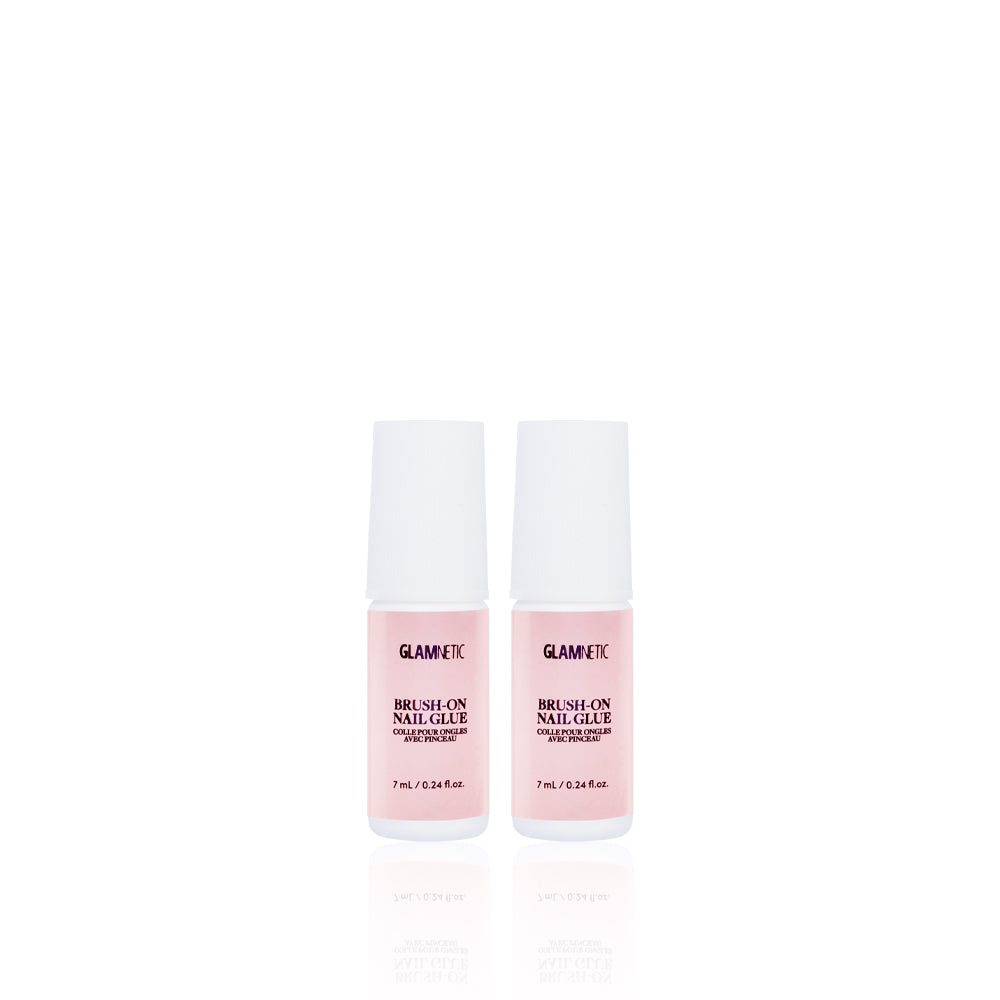 Two small pink bottles of glamnetic Glue Duo with white caps stand side by side on a white background. Labeled in black text, they’re perfect for salon-style nails.