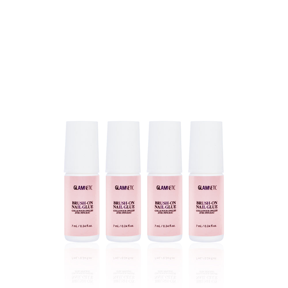 Four pink bottles of glamnetics Glue Quartet are lined up against a white background. Each vegan, cruelty-free bottle has a white cap and shows the product name plus 7 mL (0.24 fl. oz.) volume—perfect for press-on nail application.