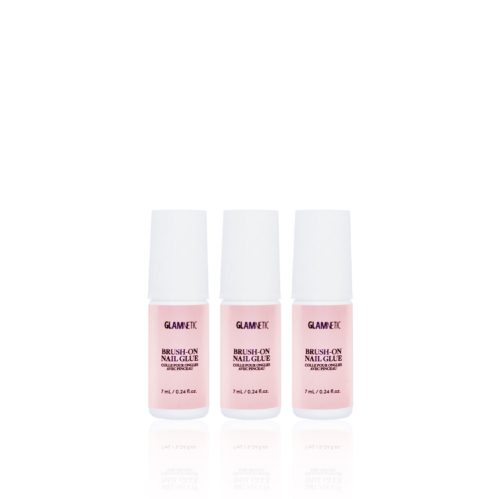 Three bottles of glamnetic Glue Trio with white caps stand side by side on a white background. Each 7 mL (0.24 fl oz) bottle is ideal for salon-quality nails and flawless press-on nail application.