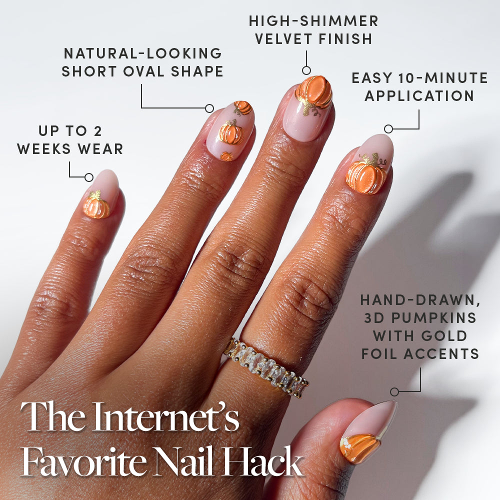 A hand with short oval Golden Gourds nails by glamnetic features gold foil accents and 3D pumpkin nail art. Text highlights their shimmering finish, quick 10-minute application, long-lasting 2-week wear, and natural look. The headline reads: The Internet’s Favorite Nail Hack. - Product image